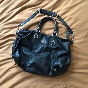 Black coach purse with purple trim